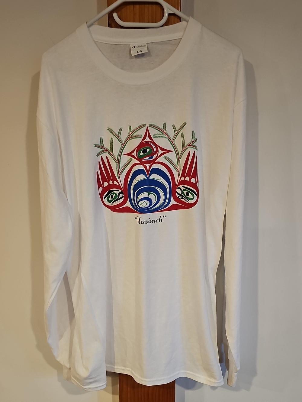 White Long-Sleeve Graphic Tee with Multicolor Crest Design